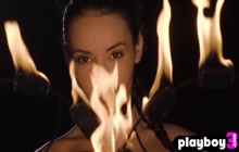Teen Elilith Noir playing with fire and posed totally naked in the dark